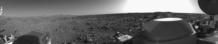 A panoramic view of Mars in black and white.