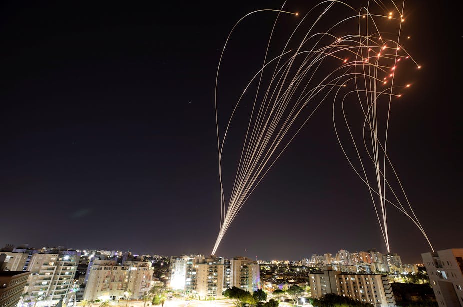 Streaks of light are seen as Israel's Iron Dome anti-missile system intercepts rockets launched from the Gaza Strip towards Israel, as seen from Ashkelon, Israel, May 11, 2021