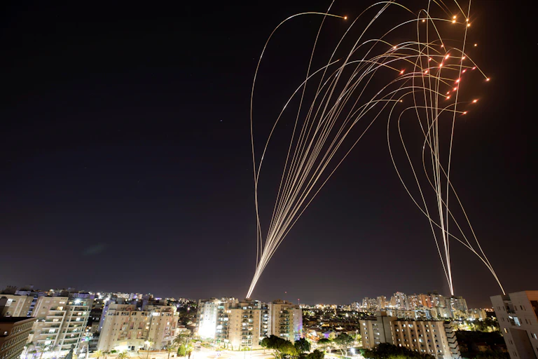 Streaks of light are seen as Israel's Iron Dome anti-missile system intercepts rockets launched from the Gaza Strip towards Israel, as seen from Ashkelon, Israel, May 11, 2021
