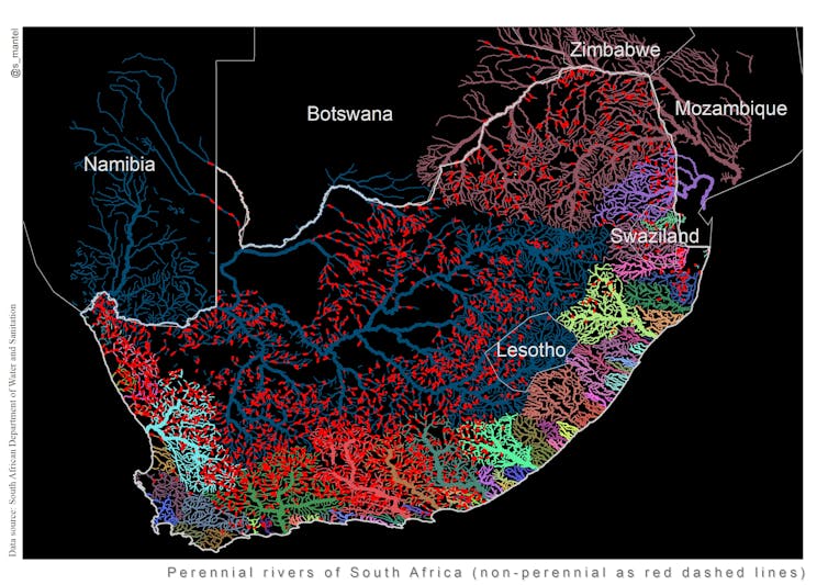 Lines of various colours, among them red, green and yellow, run along a black background.