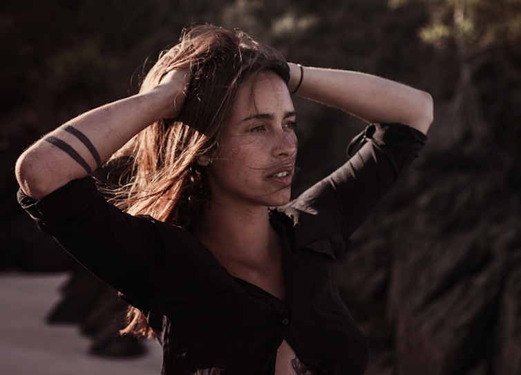 gorgeous young woman with hands in hair