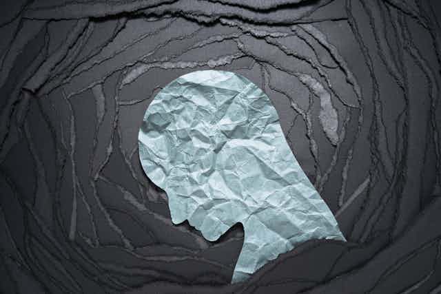 A human head shape made from paper.