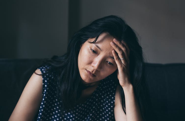 A woman appears unhappy.