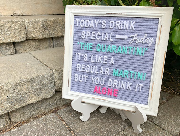 Sign that reads 'today's drink special is the quarantini, its like a regular martini but you drink it alone'