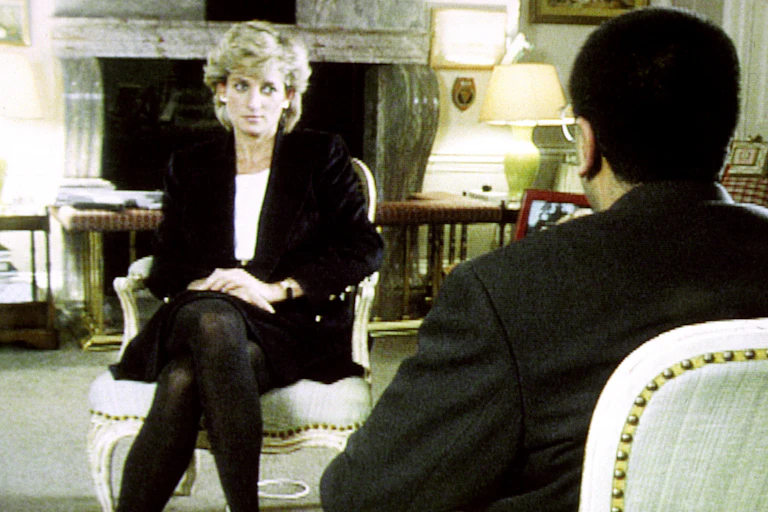 Prinecss Diana sitting crosslegged facing BBC reporter Martin Bashir.