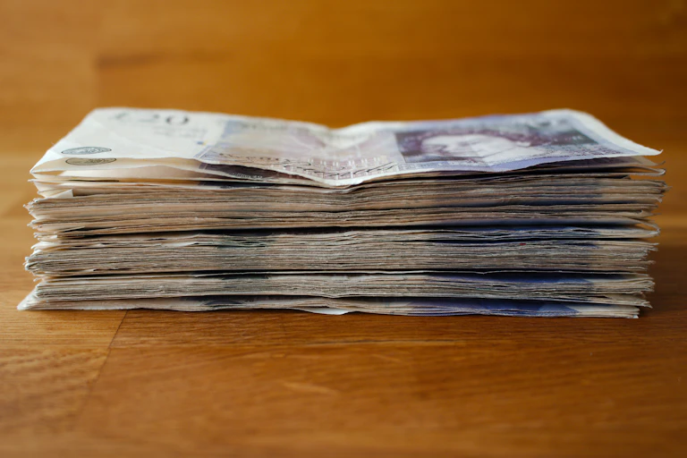 Pile of £20 notes.