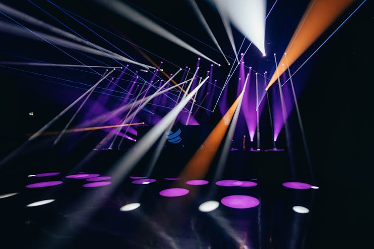 A dark empty dancefloor seen with lights