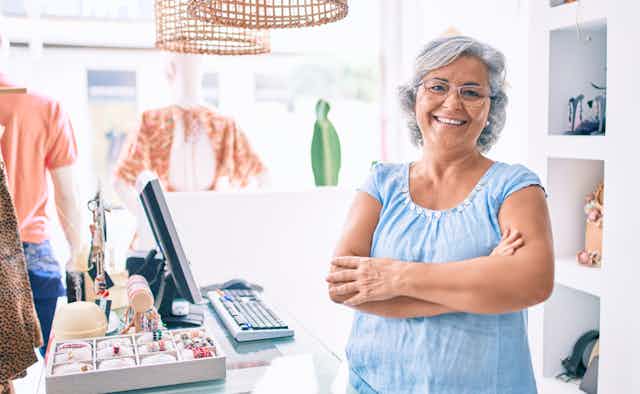 60-year-old female retail worker smiling