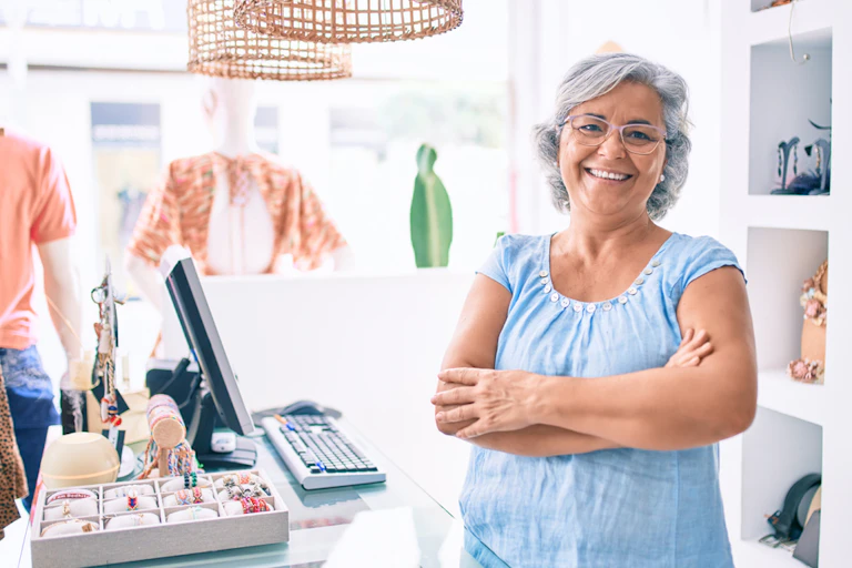 60-year-old female retail worker smiling