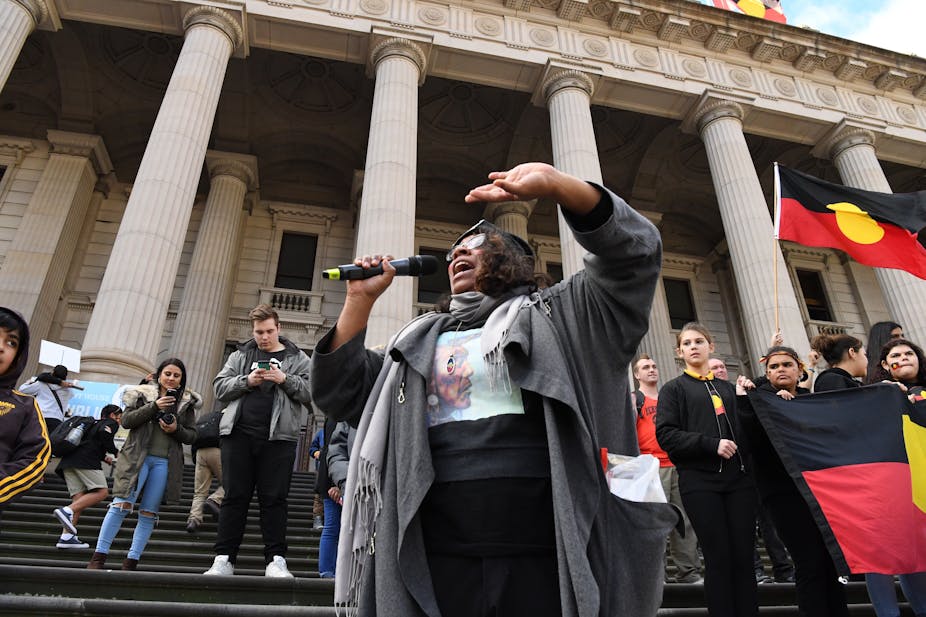 Shareena Clanton standing before Parliament House after a NAIDOC March