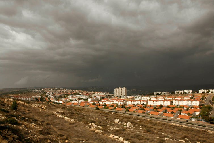 The edge of the Jewish settlement of Ariel, near the West Bank city of Nablus, under a stormy sky