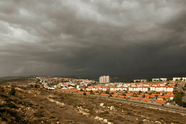 The edge of the Jewish settlement of Ariel, near the West Bank city of Nablus, under a stormy sky