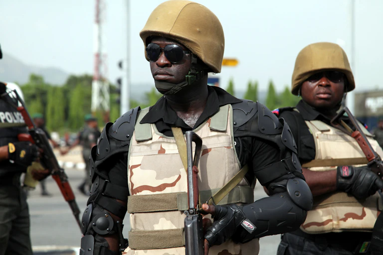 A Police officer stand guards during a demonstration that Nigerians demand release of Nigerian school girls who were kidnapped by extremist militants Boko Haram in capital Abuja, Nigeria on May 22, 2014.
