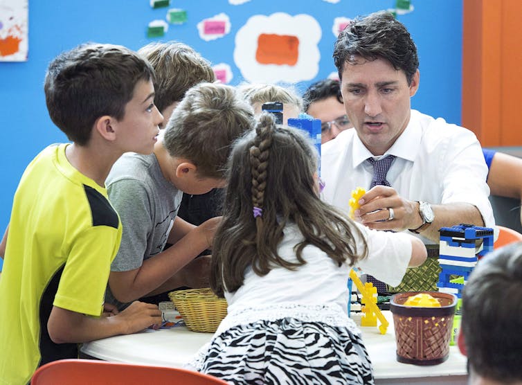 Justin Trudeau plays with children at a daycare centre.