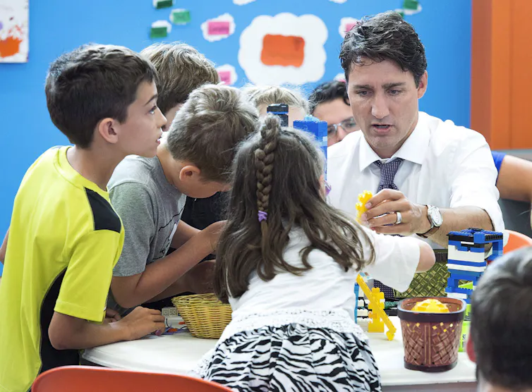 Justin Trudeau plays with children at a daycare centre.