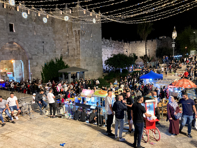 Crowds of young Palestinians celebrate Ramadan breakfast at Jerusalem's Damascus Gate, May 2021. 