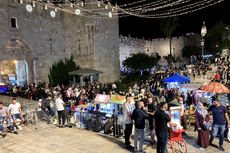 Crowds of young Palestinians celebrate Ramadan breakfast at Jerusalem's Damascus Gate, May 2021.