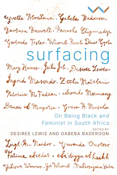 A book cover for 'Surfacing' with the names of the contributors written out in ink pen italics across the surface of the book.