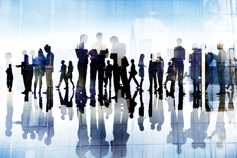 Graphic of silhouettes of people in a work place.