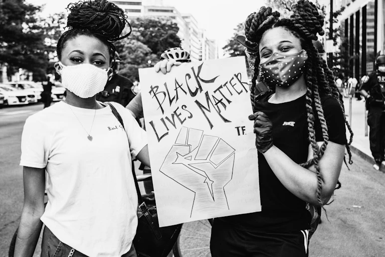 Two girls protesting the death of George Floyd in Washington June 2020.