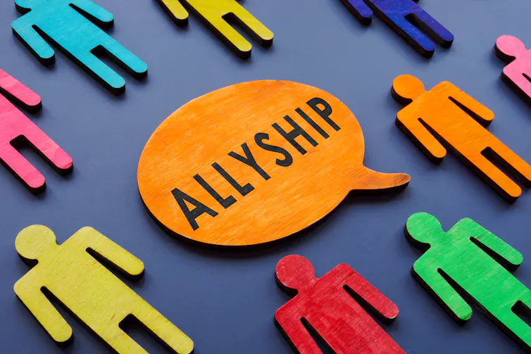 graphic showing cut-out human figures of different colopur to illustate the concept of 'allyship'