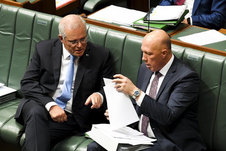 Scott Morrison with Peter Dutton in parliament