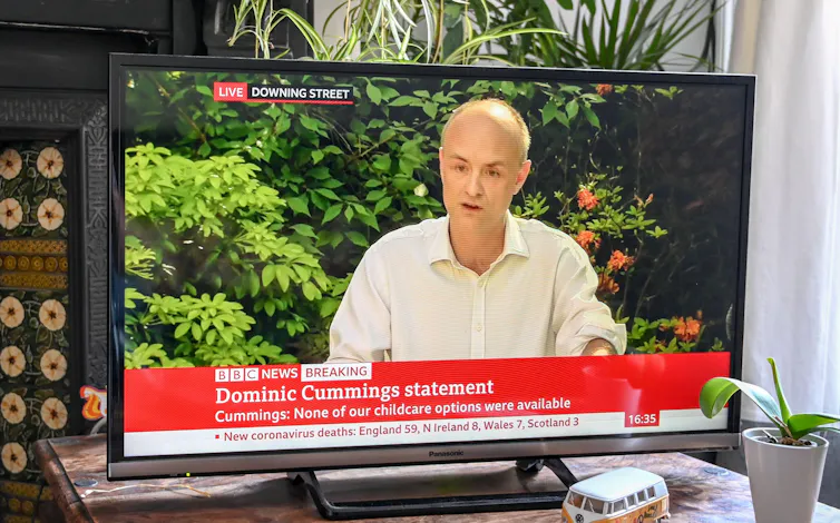 A TV screen showing Dominic Cummings giving a statement in 2020.