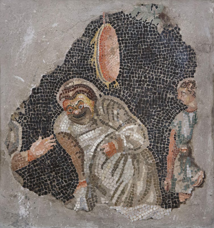 Mosaid of an ancient Roman comedy scene with a man throwing something at another man's head