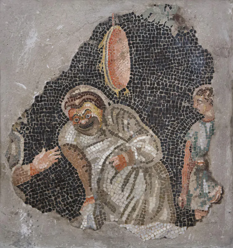 Mosaid of an ancient Roman comedy scene with a man throwing something at another man's head