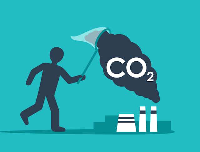 A cartoon of a person catching CO2 from factories in a net.