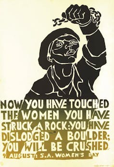 An illustration of a woman raising a hand that has a broken shackle around the wrist and the words, 'Now you have touched the women you have struck a rock; you have dislodged a boulder; you will be crushed'