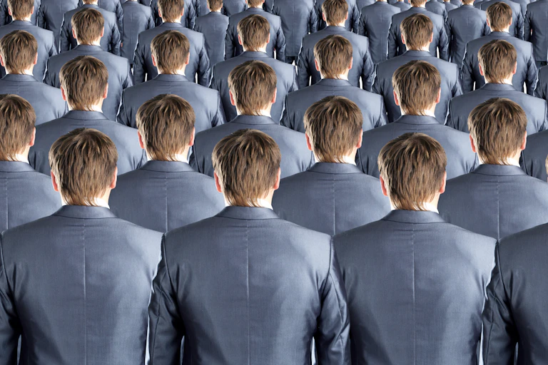 Large group of identical suit-wearing men seen from behind