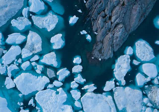 Drone aerial image of icebergs from a melting glacier in an icefjord in Greenland