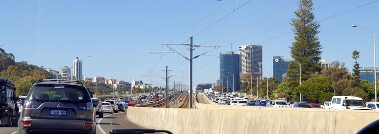 Late afternoon congestion in both directions on the Kwinana Freeway (looking north towards and onto the Narrows Bridge) in Perth, Western Australia