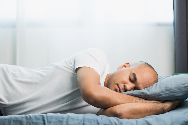 Man sleeping in bed