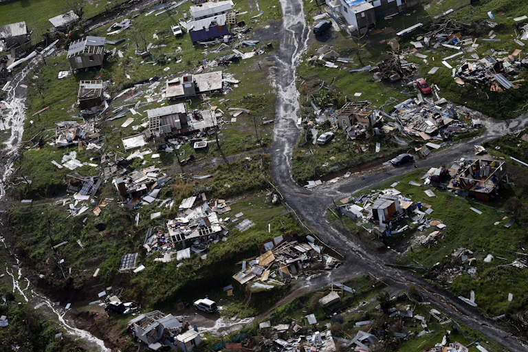 Rubble of homes scattered