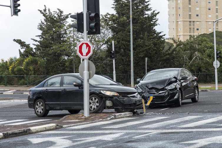 Two cars in an intersection after colliding.