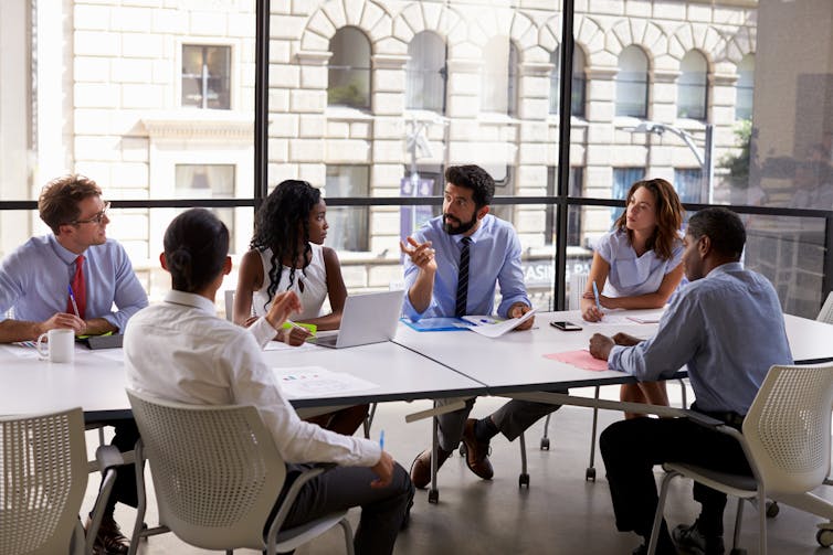 Group of business people sitting at a table