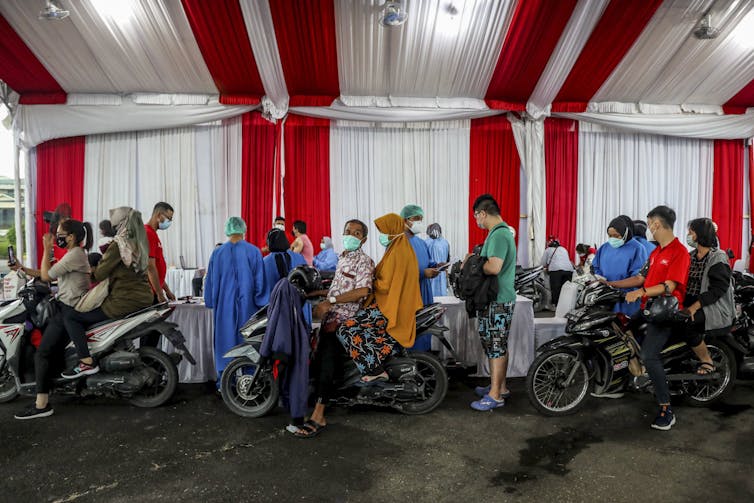 A drive-through vaccination booth in Medan.