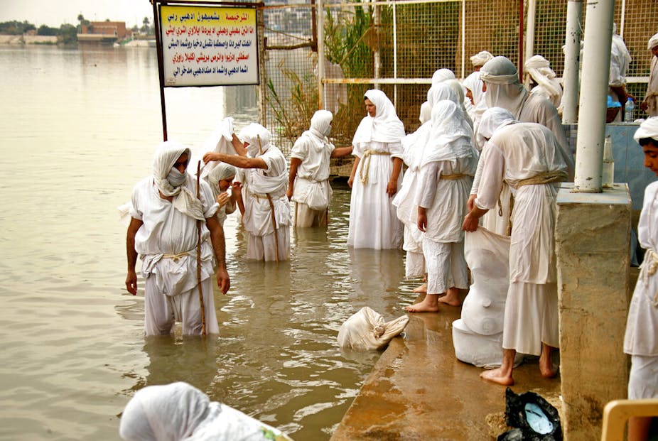 Followers of the Sabean Mandaeans faith, a pre-Christian sect that follows the teachings of the Bible's John the Baptist, perform their rituals in the Tigris River during a celebration marking "Banja" or Creation Feast, in central Baghdad, Iraq, Monday, March 15, 2021. 
