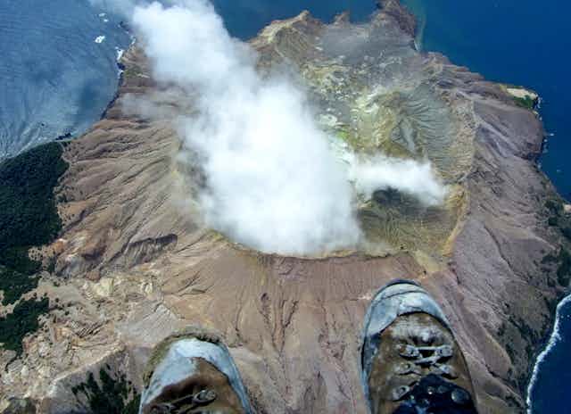 Aerial view of steaming volcano