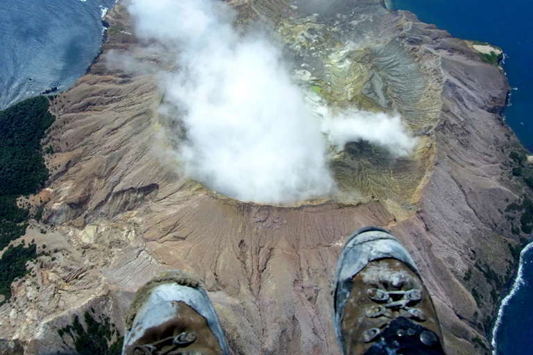 Aerial view of steaming volcano