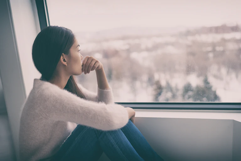 A woman looking out of the window