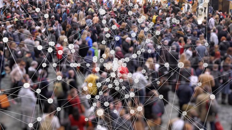 Crowd of people overlaid by a computer web