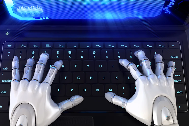 human-like robot hands on a laptop keyboard