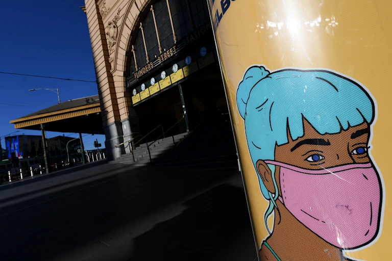 A piece of street art, depicting someone in a face mask, on Flinders Street Melbourne