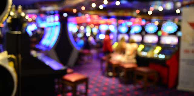 Blurred image of poker machines.