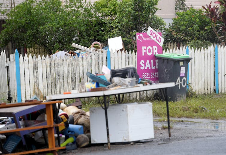 Sodden belongings outside home