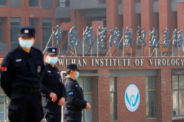 Security personnel keep watch outside Wuhan Institute of Virology 