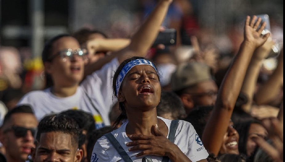 Une femme participe à un rallye de congrégations évangéliques, la "Marche pour Jésus", à Sao Paulo, le 20 juin 2019. 